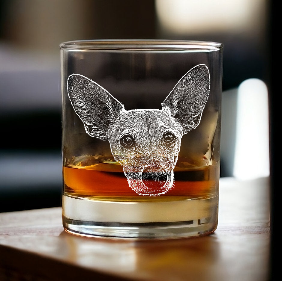 a dog with big ears engraved into a whiskey glass, your pet etched